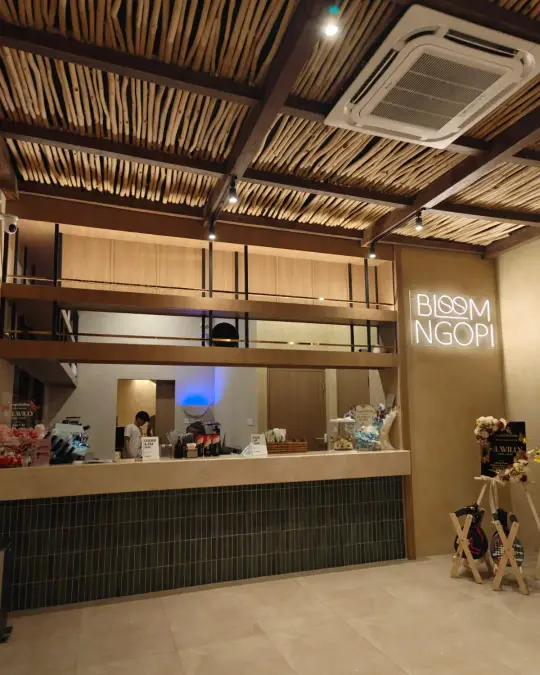The Bloom Ngopi counter under a timber ceiling