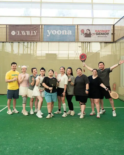 A group of players posing on court
